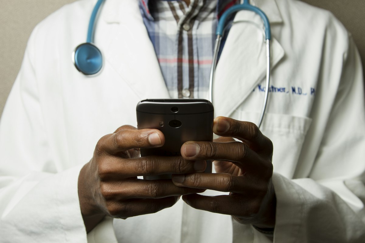 Clinician reviewing a patient record on a tablet